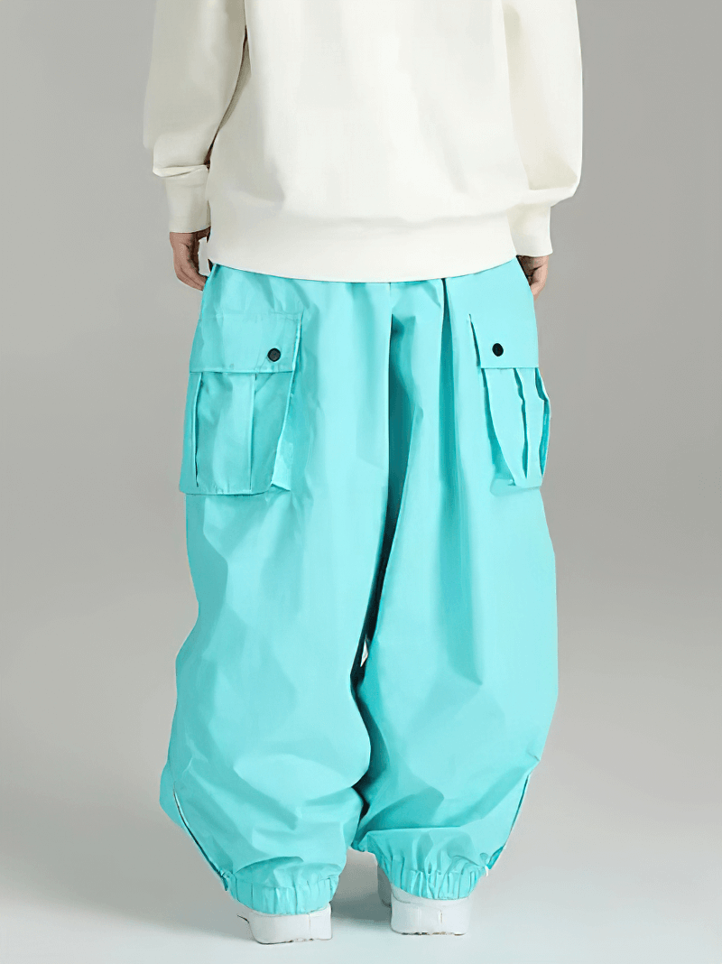 Back view of turquoise unisex snowboarding pants with cargo pockets, designed for extreme weather. Waterproof and warm for winter sports.