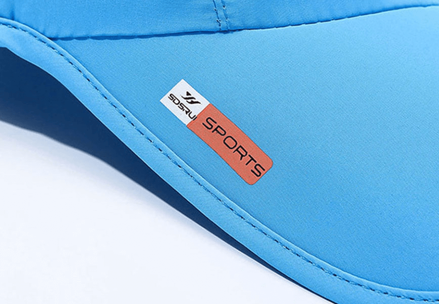 Close-up of a blue waterproof and breathable outdoor sports baseball cap featuring an adjustable strap and sports tag for added style.