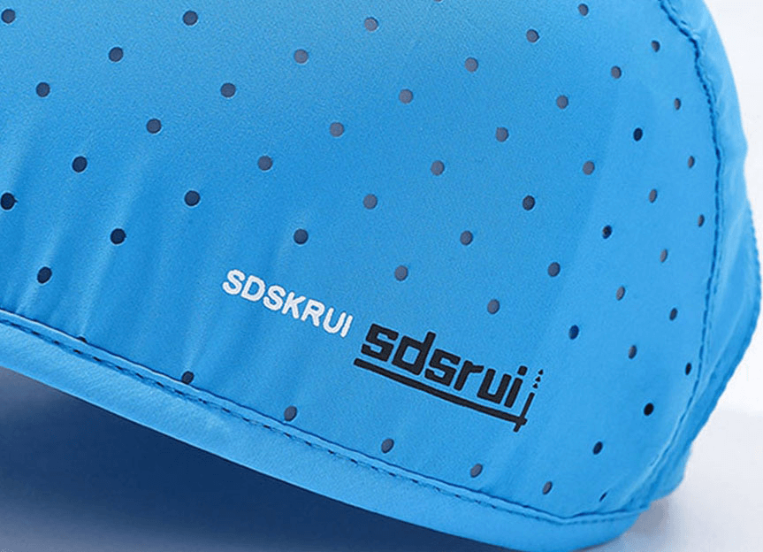 Close-up of a blue waterproof breathable baseball cap with black dotted pattern and logo.