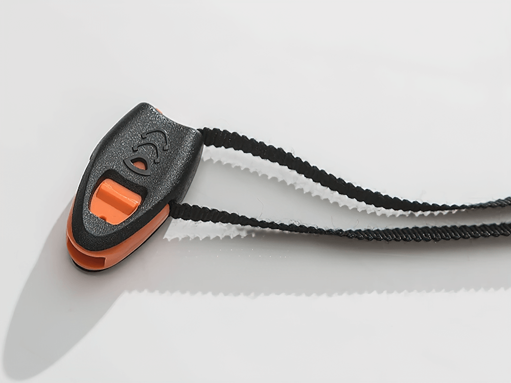 Compact black and orange tool on a braided cord, ideal for outdoor adventures and utility tasks.