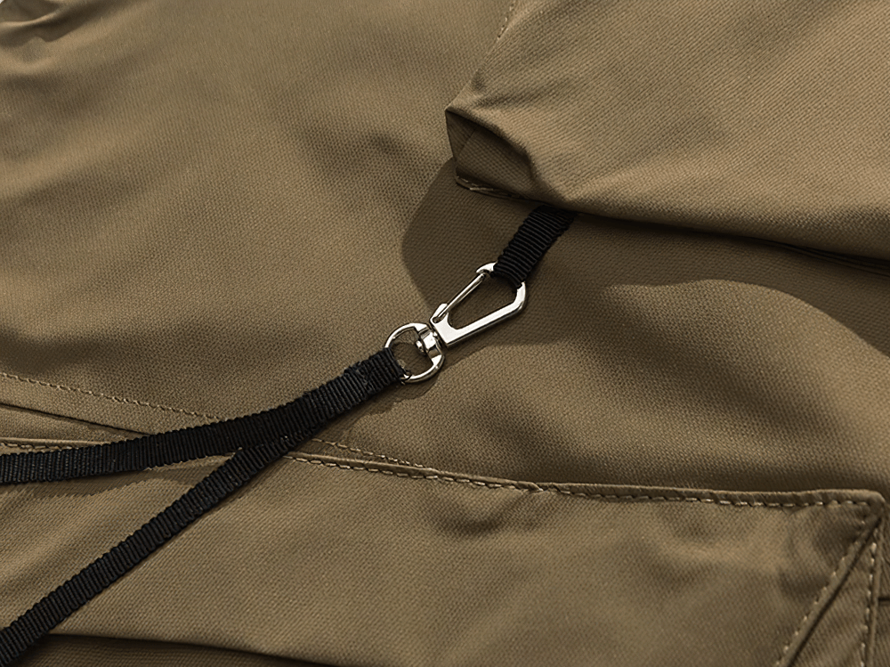 Close-up of a rugged tactical utility vest with durable polyester fabric and secure strap detail, perfect for outdoor adventures.