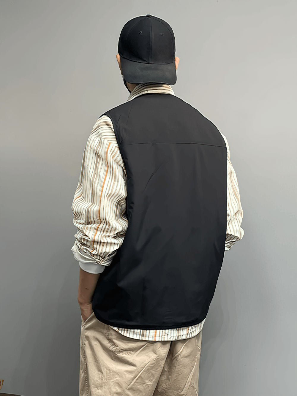 Back view of person wearing Outdoor Tactical Utility Vest SF2285, showcasing lightweight design for hiking and fishing adventures.