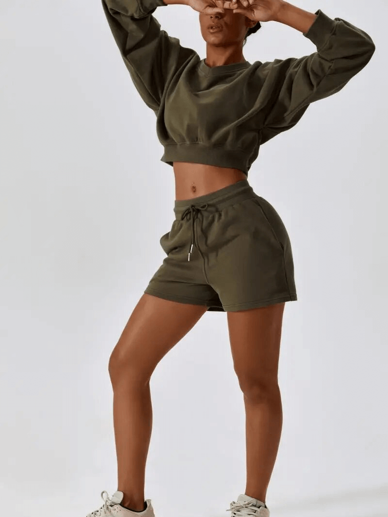 Alt Tag: Woman wearing cotton loose sweatshirt and shorts, perfect for yoga, featuring long sleeves and comfortable fit, SF1682.