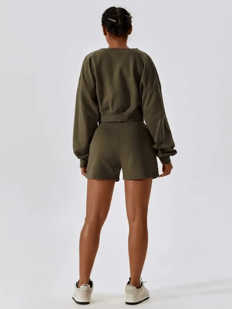 Woman wearing the SF1682 fitness cotton loose sweatshirt and shorts set in army green, ideal for yoga and comfort.