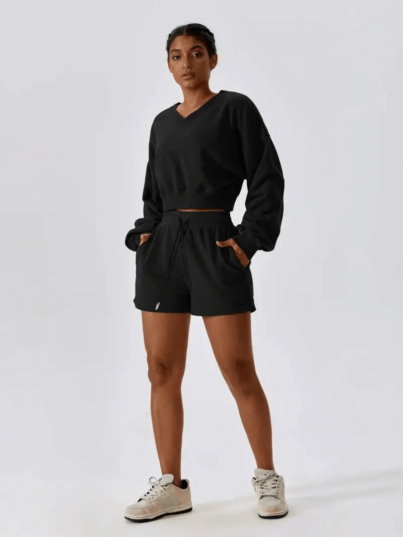 Woman wearing Outfit Fitness Cotton Loose Sweatshirt and Shorts SF1682, perfect for yoga and comfort in premium cotton.