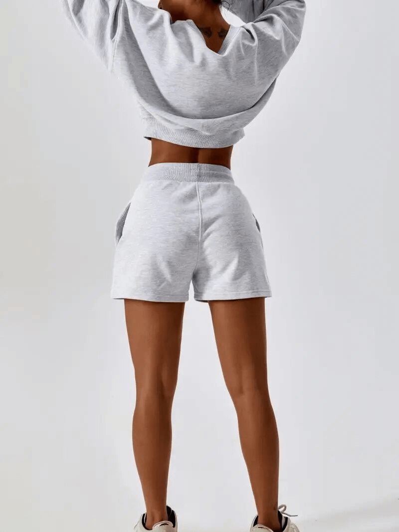 Back view of Outfit Fitness Cotton Loose Sweatshirt and Shorts for women, featuring a cozy sweatshirt and thermal shorts, style SF1682.