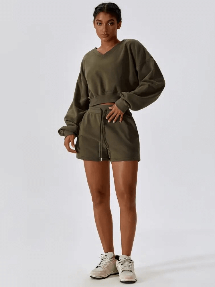 Woman wearing loose cotton sweatshirt and shorts set for yoga, SF1682, showing full sleeves and thermal shorts, perfect for flexibility.