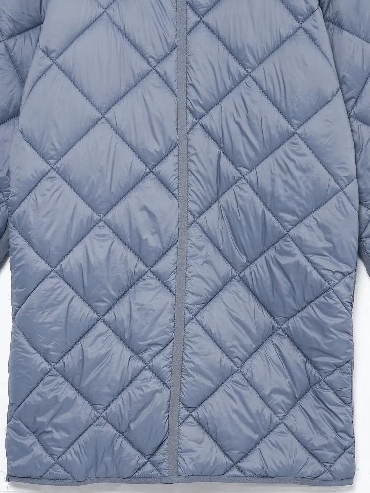 Stylish blue quilted oversize long sleeves warm coat with buttons and pockets, ideal for chic winter wear.