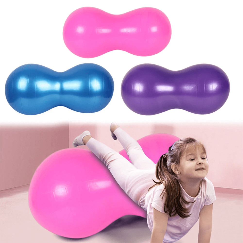 Child playing on pink peanut balance exercise ball with blue and purple options in background for yoga and training.
