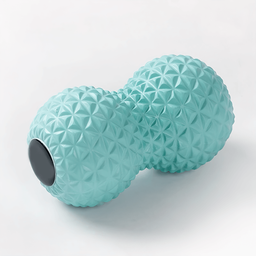 Turquoise peanut-shaped massage ball with spiky texture for muscle relief and stress reduction.