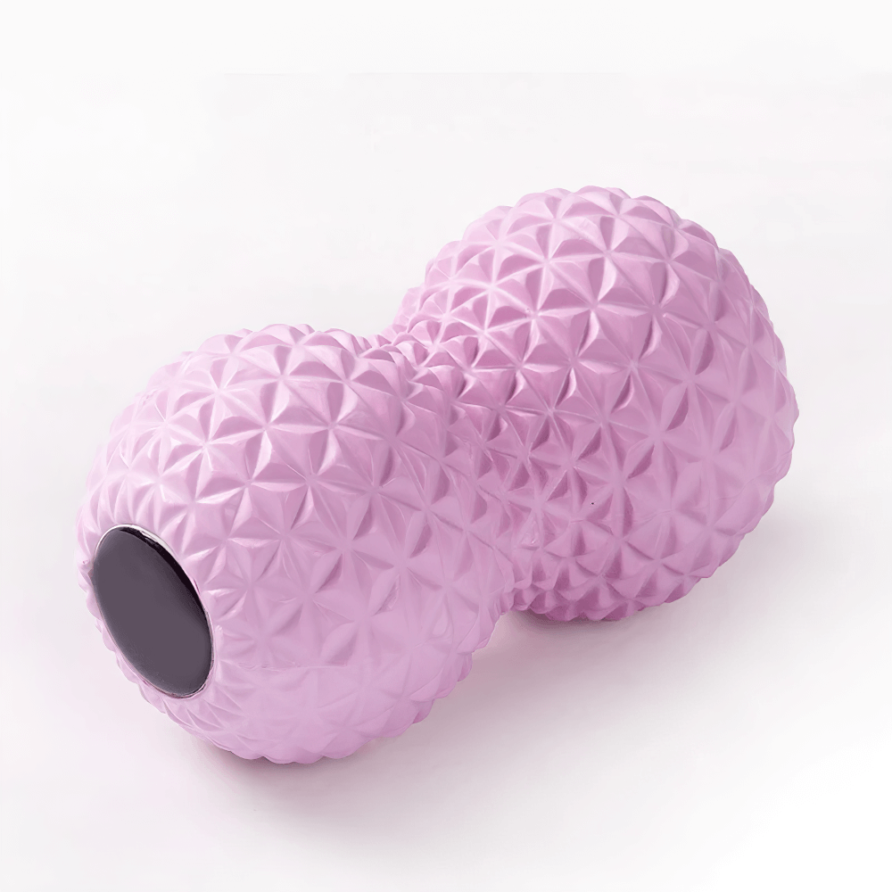 Pink peanut-shaped massage ball with spiky texture for muscle relief and stress reduction.