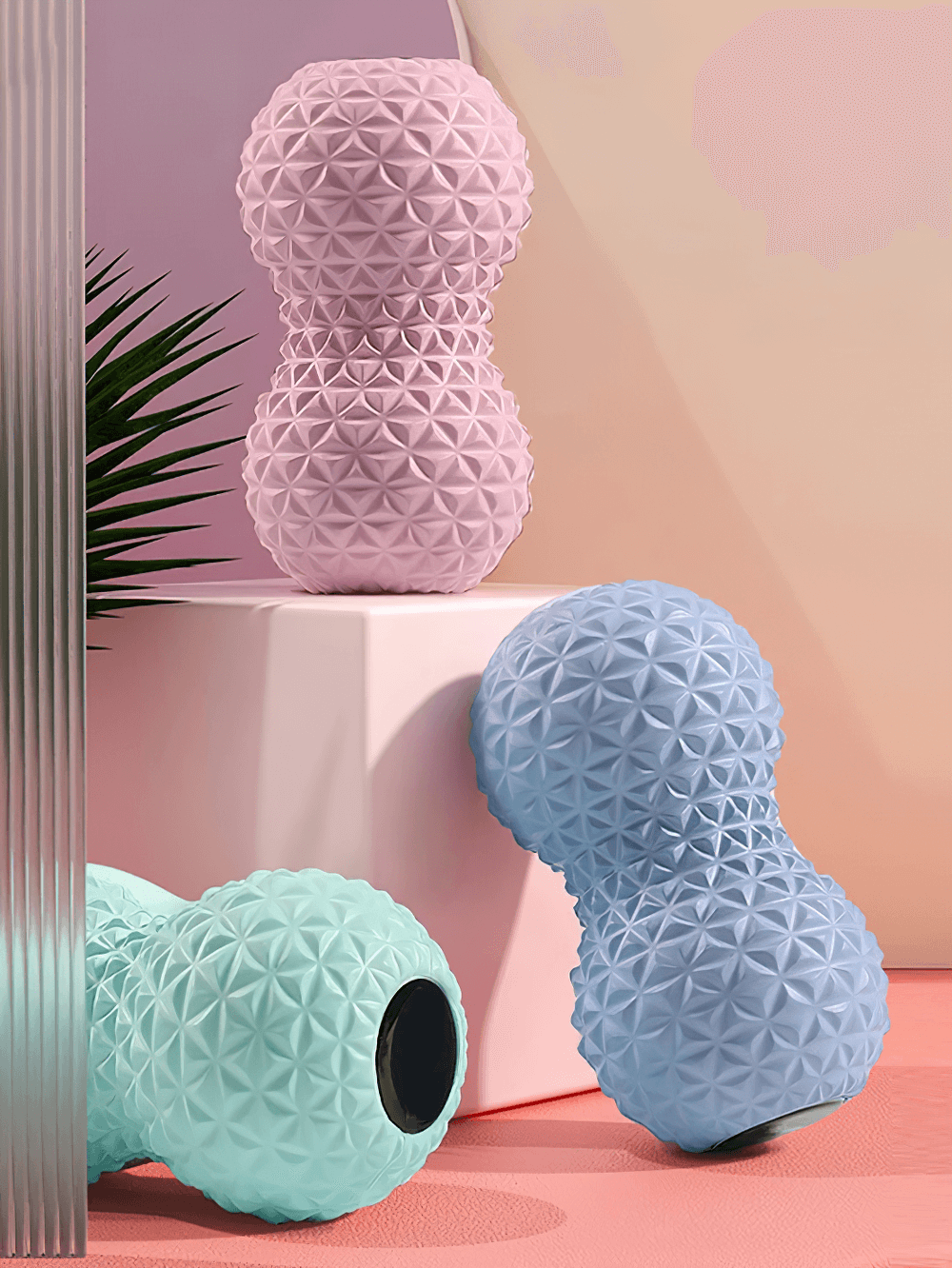 Colorful peanut-shaped massage balls with spiky texture for muscle relief and stress reduction.