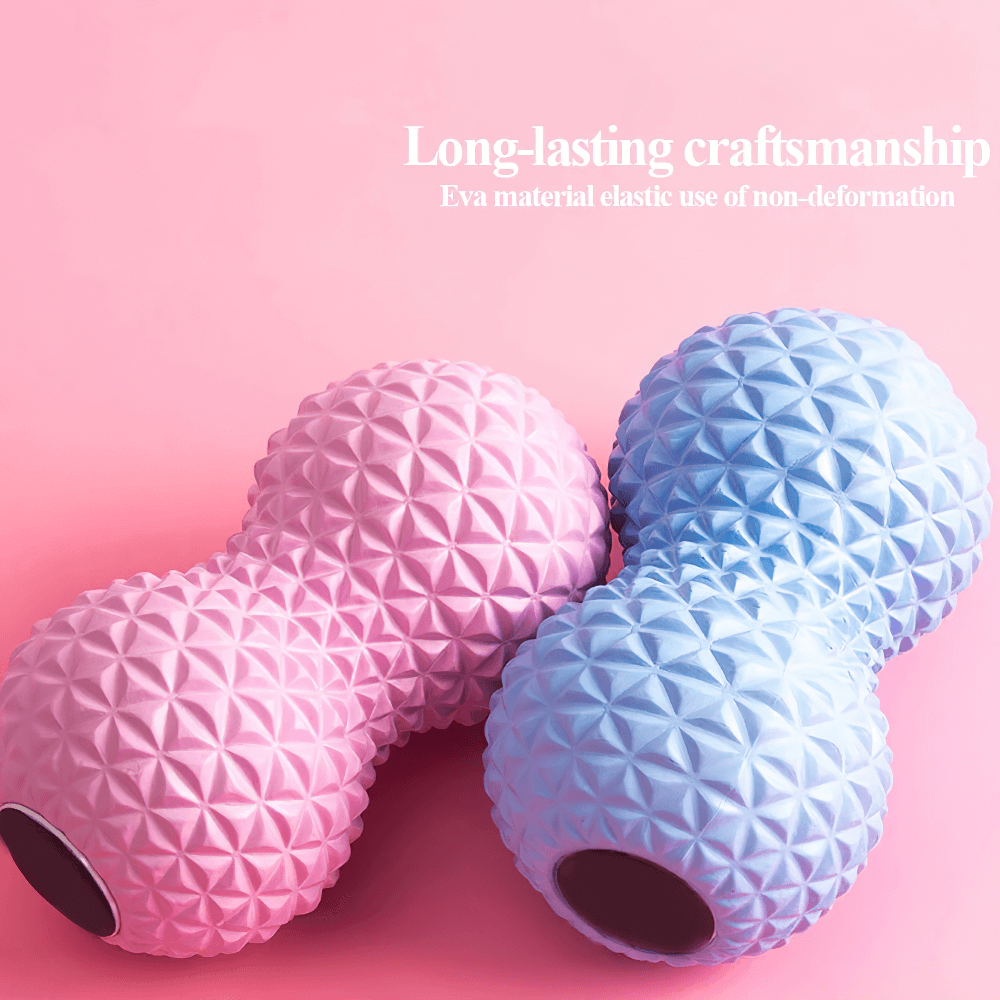Pink and blue peanut-shaped massage balls for muscle relief on a pink background, showcasing long-lasting craftsmanship.