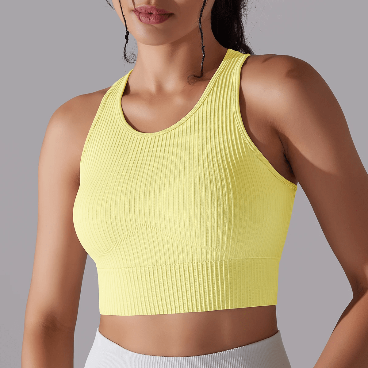 Ribbed yellow yoga short tank top for women, knitted, breathable nylon, solid color, perfect for enhancing yoga sessions.