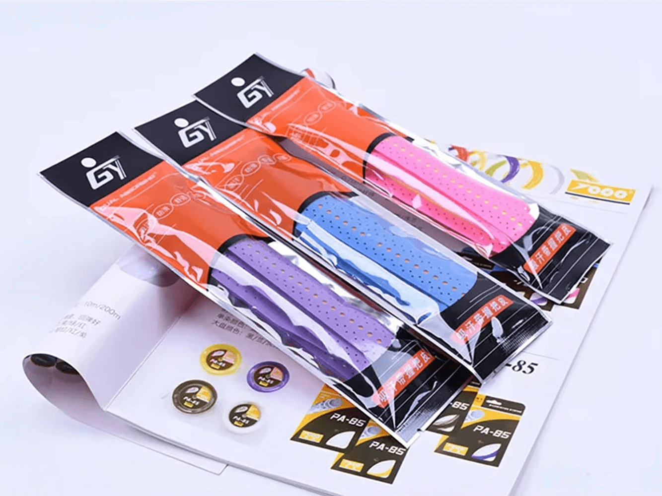 Colorful selection of Perforated Anti-Slip Tennis Racket Overgrip Tape - SF3437 on display