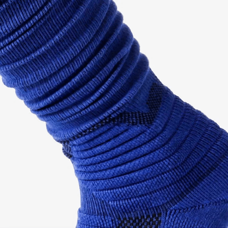 Close-up of blue ribbed compression knee-high rugby sock, showcasing durable, elastic design for enhanced comfort and performance.