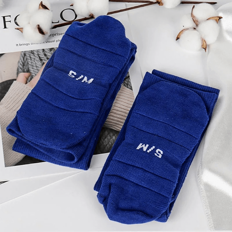 Bright blue ribbed knee-high compression socks, perfect for rugby and athletic performance, showcasing a durable and snug fit design.