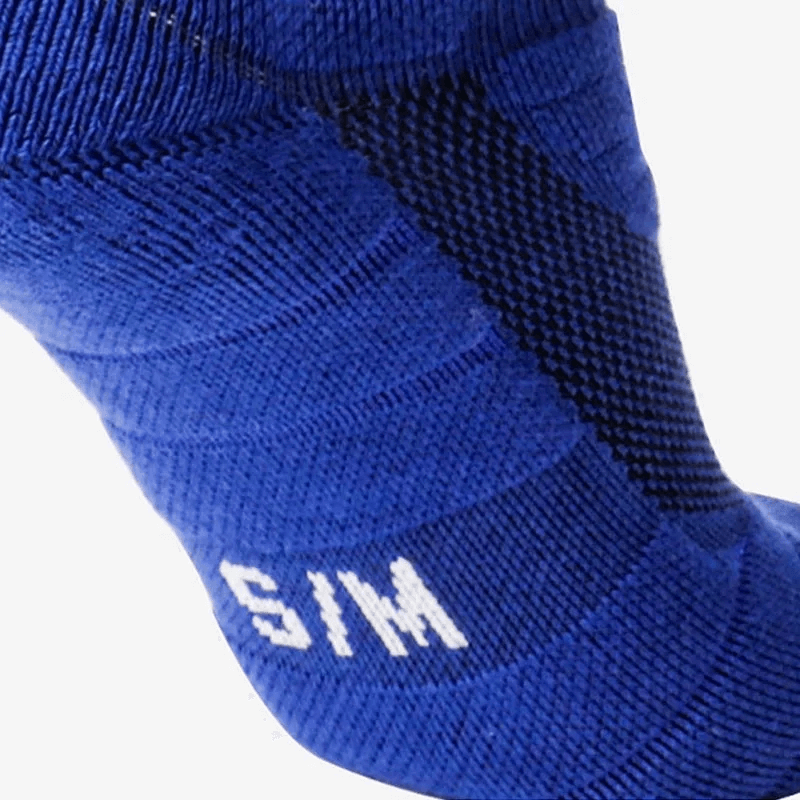 Close-up of blue ribbed compression knee-high rugby sock showing size label S/M.