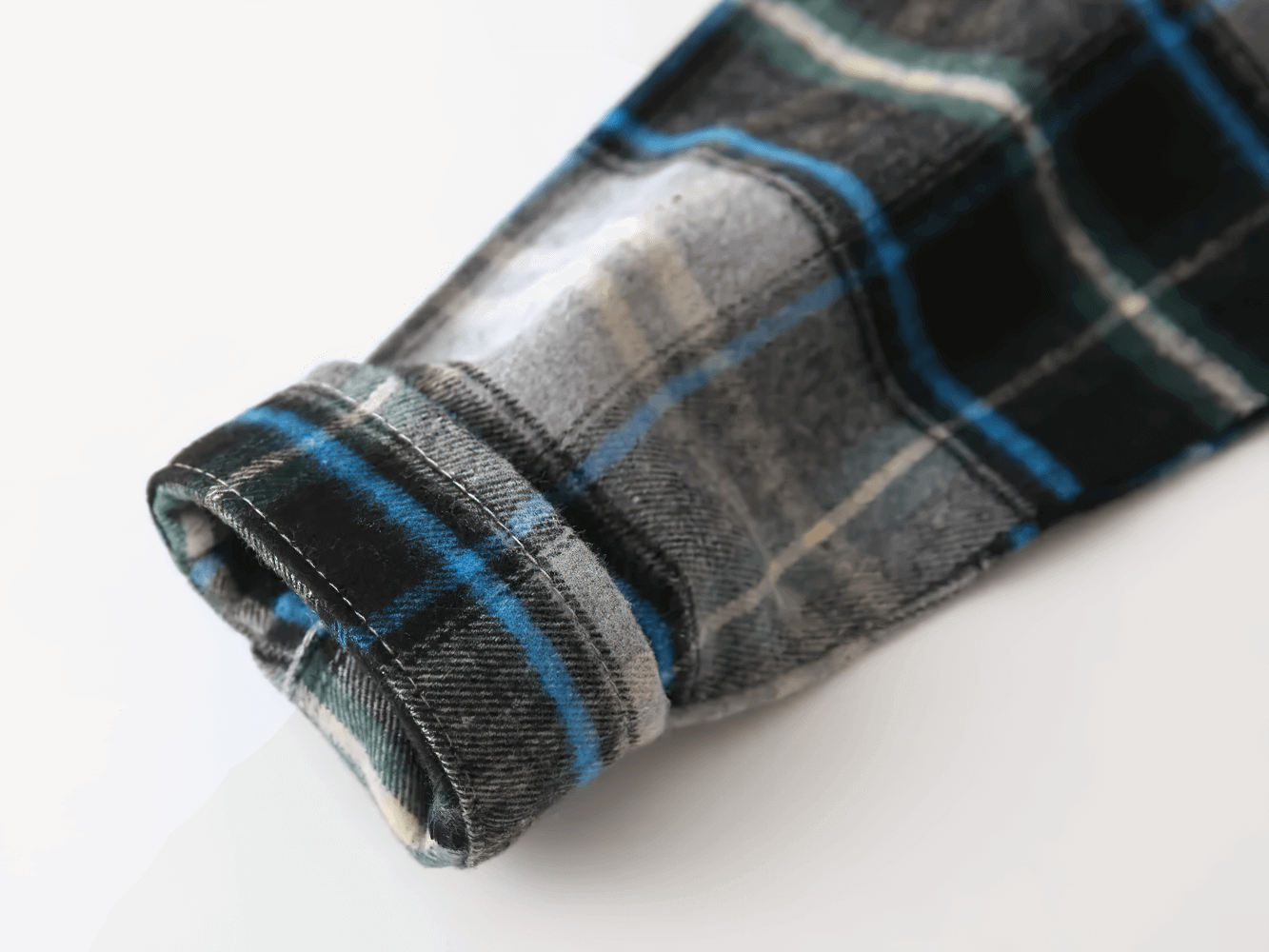 Close-up of Plaid Hooded Long Sleeved Shirt for Boys and Girls - SF3524 sleeve in blue and black flannel pattern.
