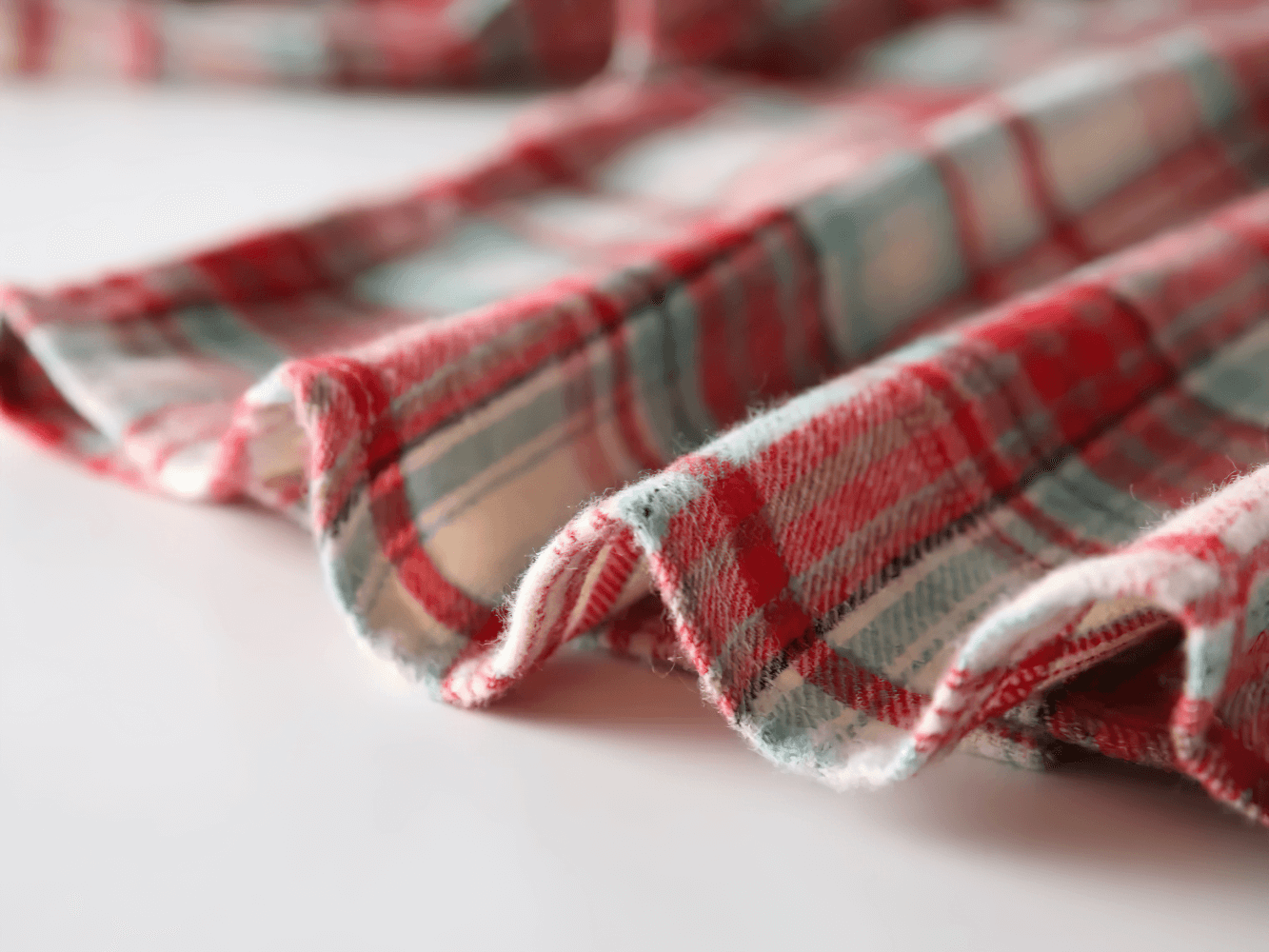 Close-up of Plaid Long-Sleeved Button-Down Shirt for Kids - SF3523 in soft flannel fabric, showcasing red and green checked pattern.