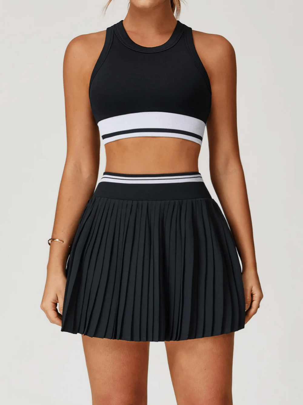 Pleated Tennis Skirt and Racerback Crop Top Set - SF4582 in black, showcasing stylish pleats and sporty design.