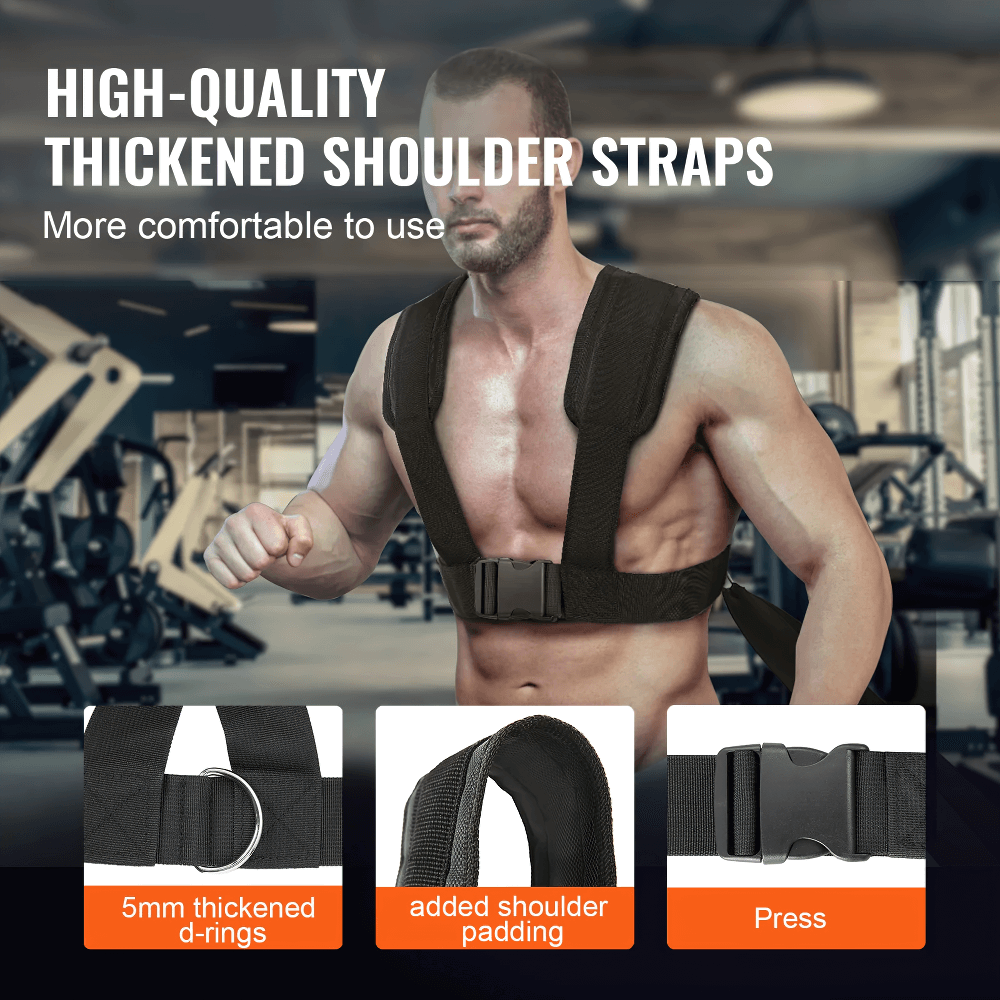 Man wearing a power training sled harness with thick shoulder straps, enhancing comfort and durability in a gym setting.