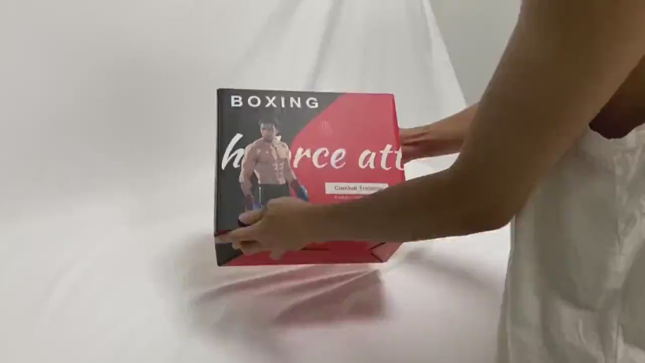 Person holding a boxing training set box on a white background