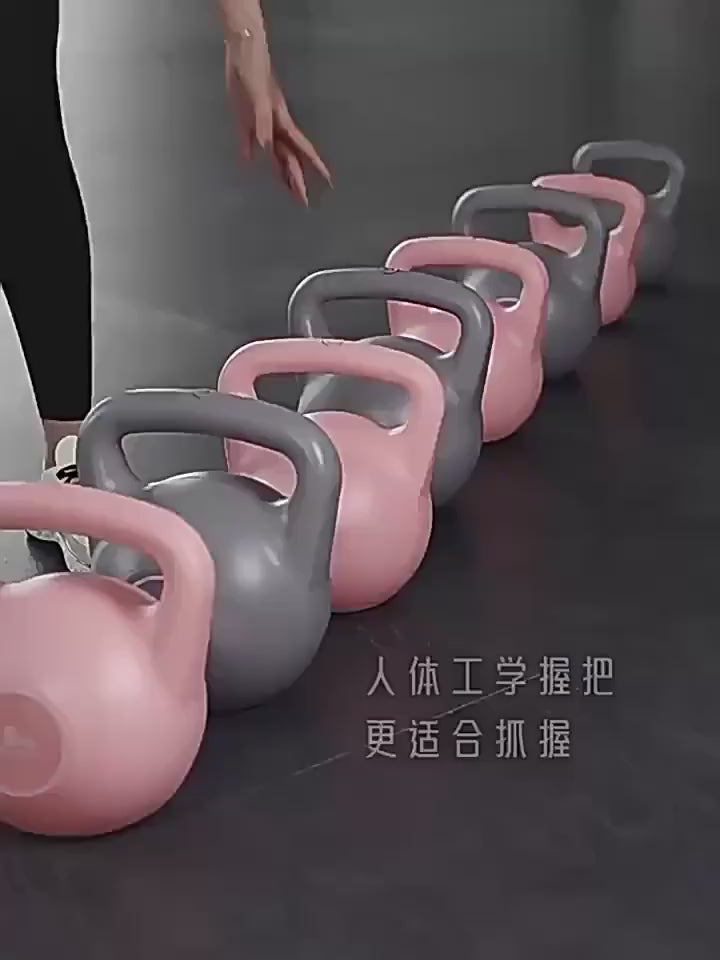 Row of pink and gray water-filled kettlebells with ergonomic handles for strength training and customizable workouts.