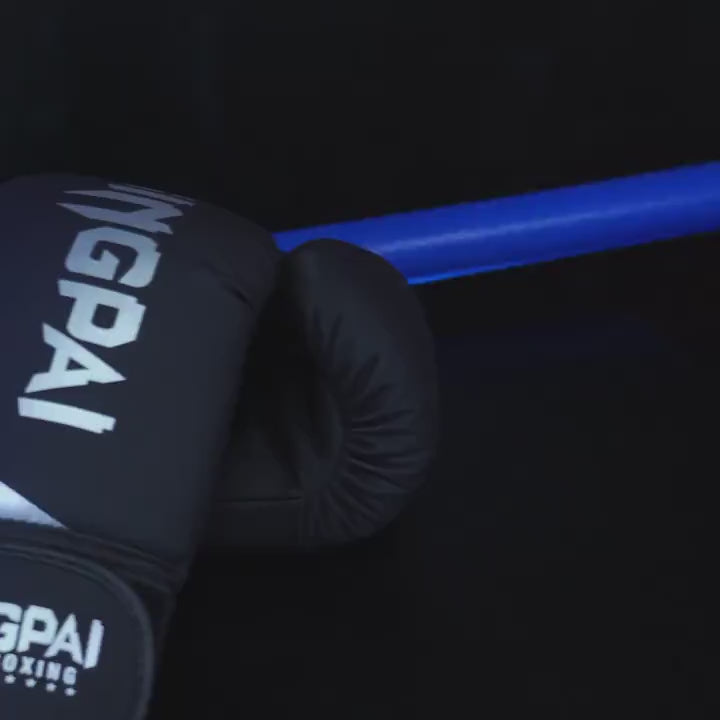 Black PU leather boxing glove with gold accents on a gripping blue rod, featuring a secure hook-and-loop closure for training and sparring.