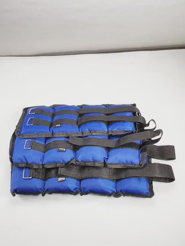 Blue adjustable ankle and wrist weights with velcro straps for resistance training, ideal for leg and arm workouts.