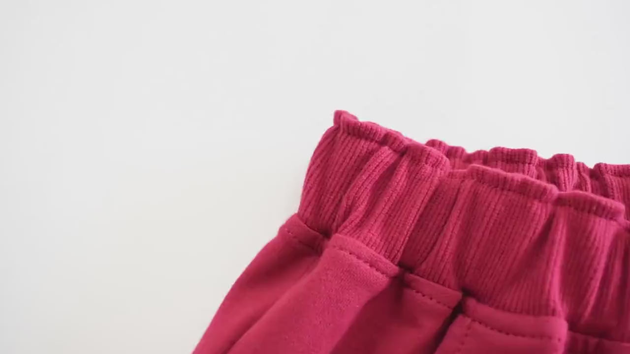 Close-up of Kids Drawstring Shorts with Pockets and Buttons - SF3791, featuring a soft knit texture and stretchy waistband detail.