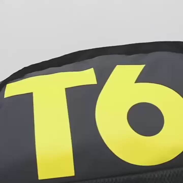 Close-up of transformable backpack with bold yellow T6 lettering, showcasing sports style and durable construction.