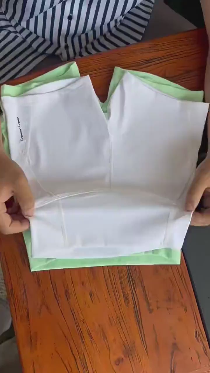 Girls High-Waisted Sport Shorts for Yoga and Running - SF3838 displayed on a wooden table with a green background.