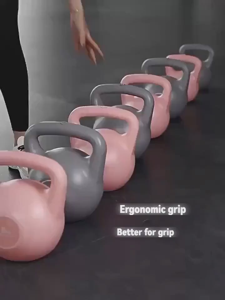 Row of ergonomic grip kettlebells in pink and gray for home and gym workouts, ideal for strength training and stability exercises.