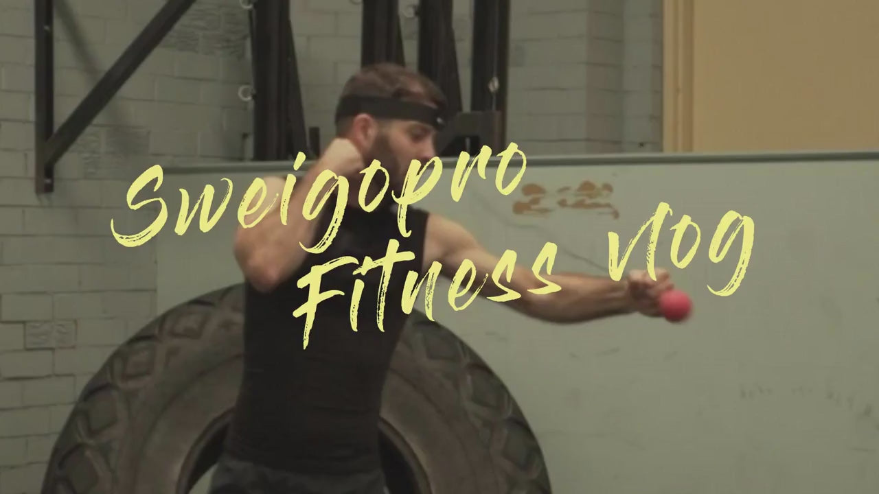 Man training with boxing reflex ball headband in gym; Sweigopro Fitness Vlog text overlay.