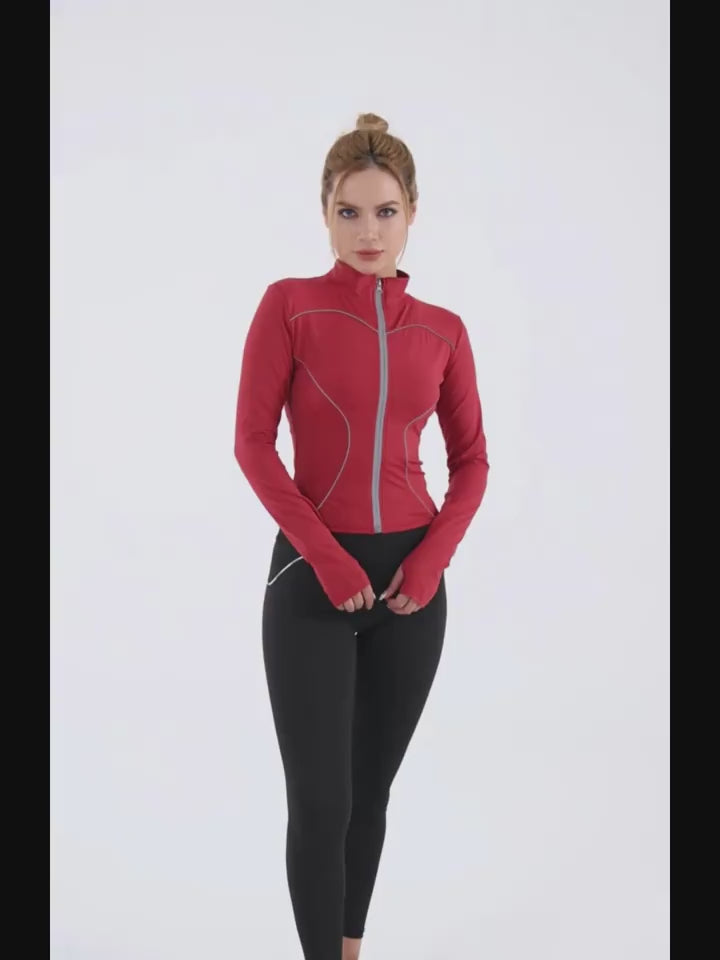 Model wearing a red Slim Fit Sports Jacket with full zip and thumb holes, ideal for workouts and running with reflective details for visibility.