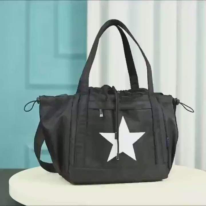 Black nylon star pattern shoulder bag with drawstring closure and adjustable strap, perfect for travel and daily use - SF2661.