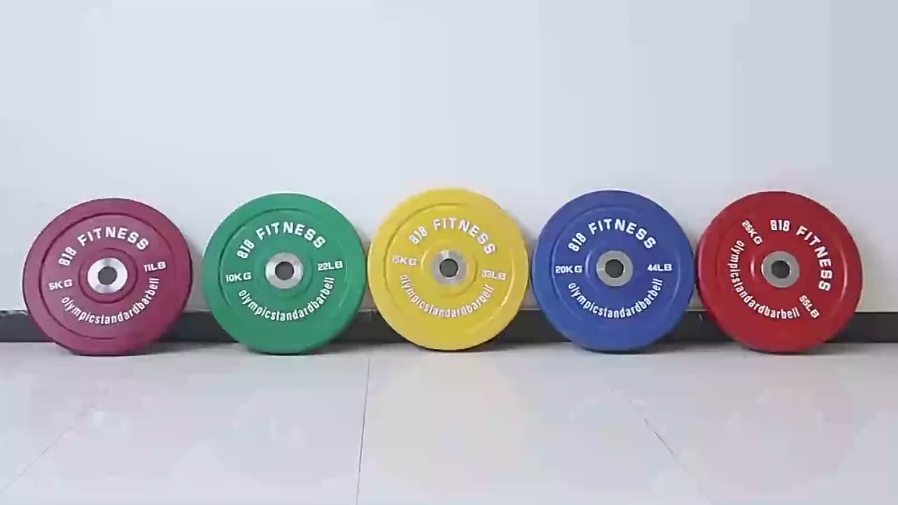 Colorful rubber barbell weight plates lined up for gym use, featuring durable SF3388 design suitable for strength training.
