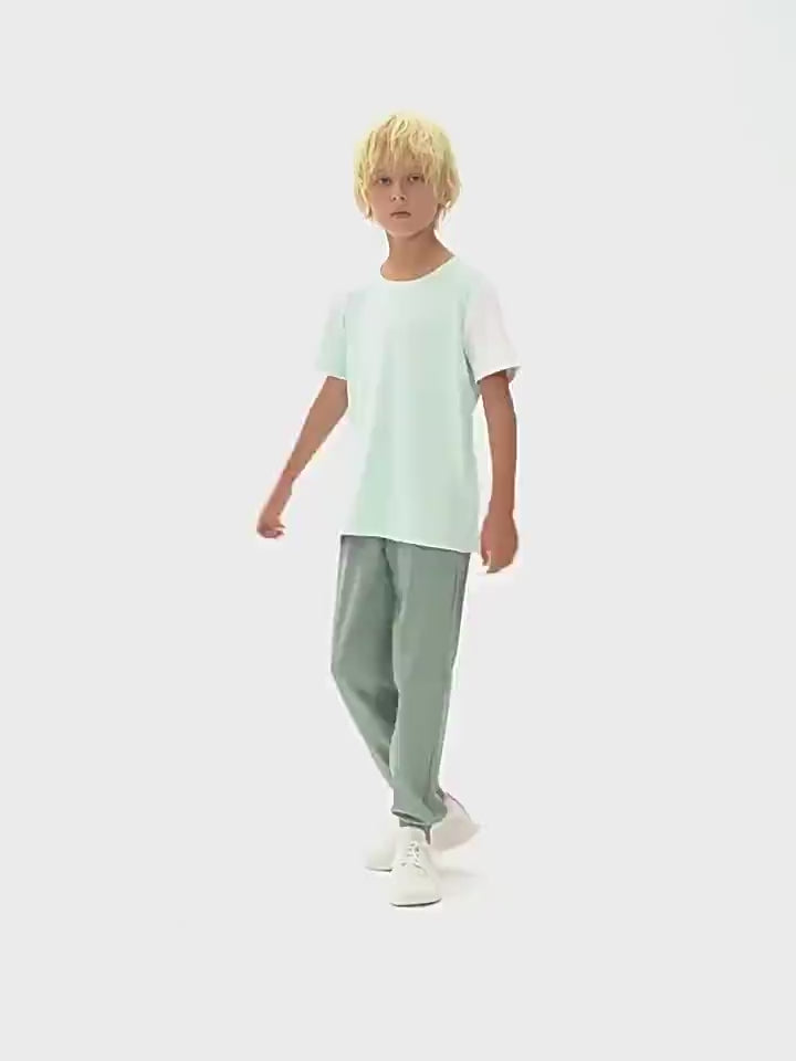 Child wearing Kids Sport T-Shirt with Mixed Color Raglan Sleeves - SF3856, perfect for active play and outdoor adventures.