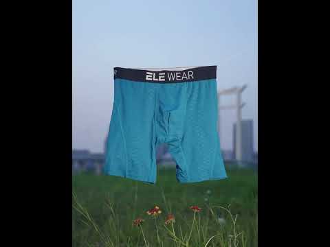 Snake Print Textured Long Boxer Briefs for Men - SF4747 hanging outdoors in a field against a twilight sky.