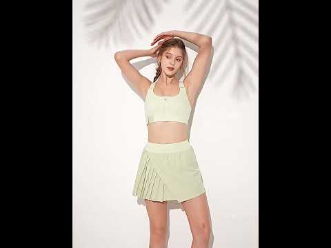 Women's Pleated Sports Skort With Hidden Shorts - SF4571 in light green with pleated detail.