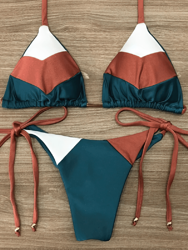 Colorful lace-up women's swimsuit with a stylish patchwork print, perfect for beach days and pool parties.
