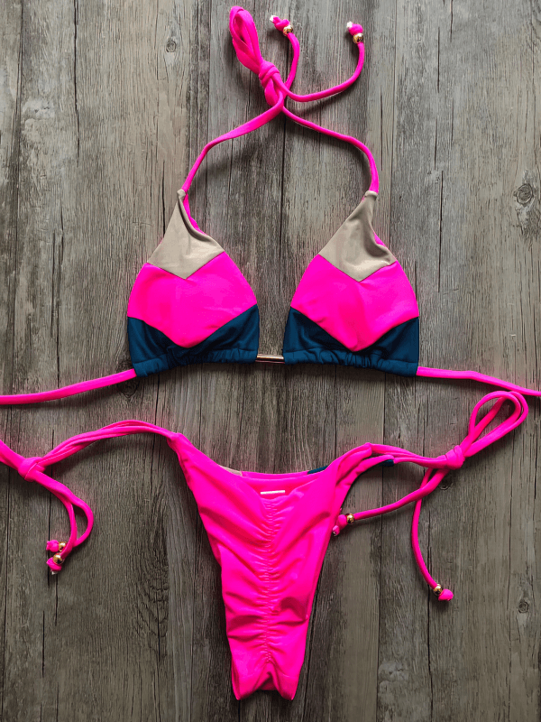 Vibrant patchwork lace-up bikini swimsuit in pink and blue, perfect for a stylish beach day, crafted from premium Nylon.