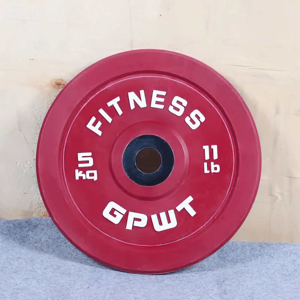 Red rubber barbell weight plate labeled 'Fitness GPWT' with 5 kg and 11 lb markings, ideal for strength training.