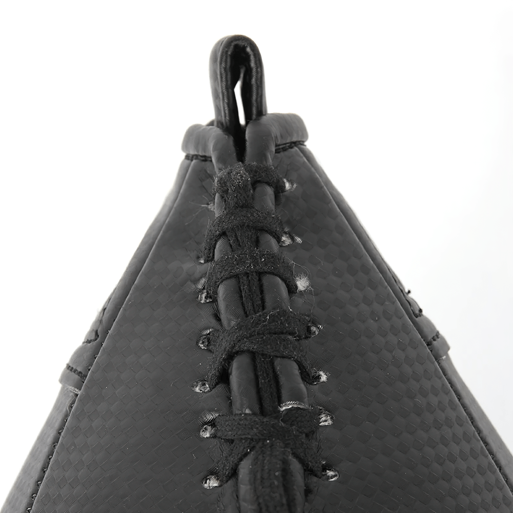 Close-up of black PU Speed Punch Ball with reinforced stitching for boxing precision.