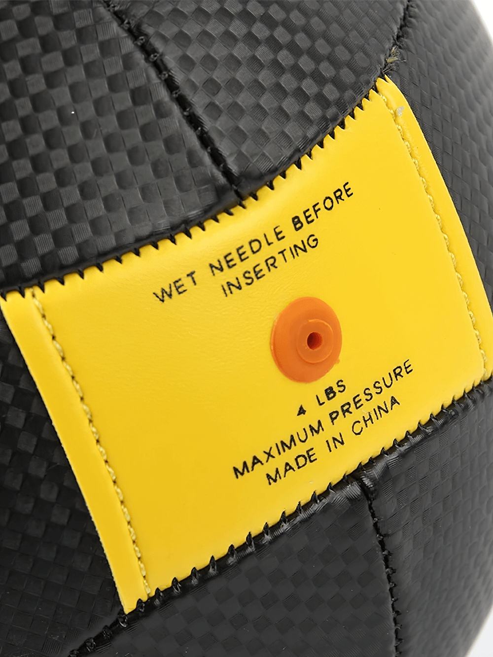 Close-up of PU Speed Punch Ball inflation point and instructions "Wet Needle Before Inserting" with yellow patch detail.