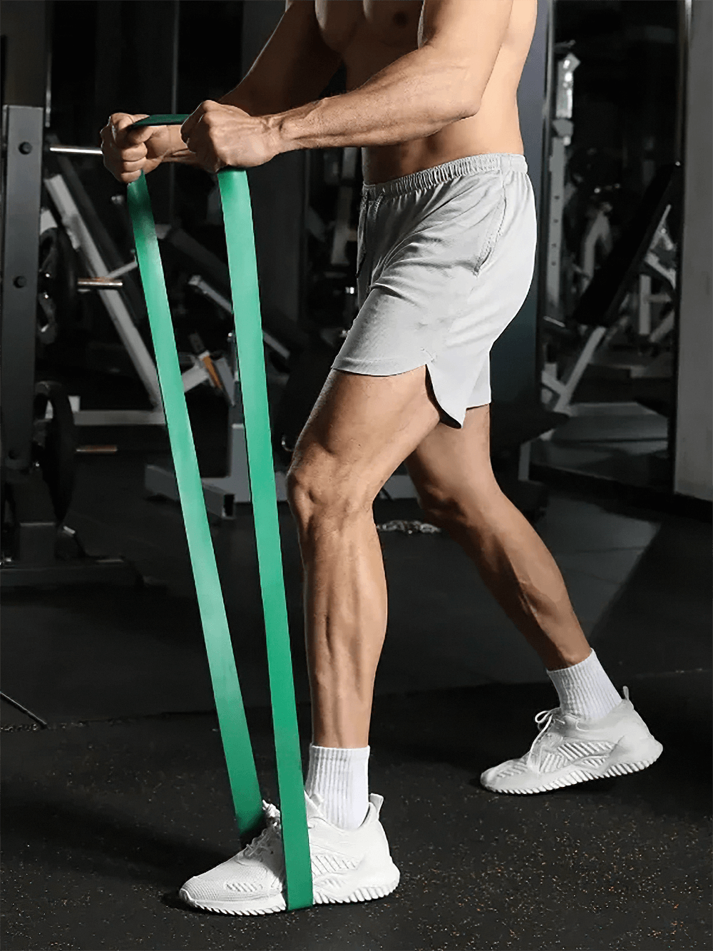 Person working out with green pull up resistance bands in gym, perfect for home workouts, strength training, and Pilates, SF3411.