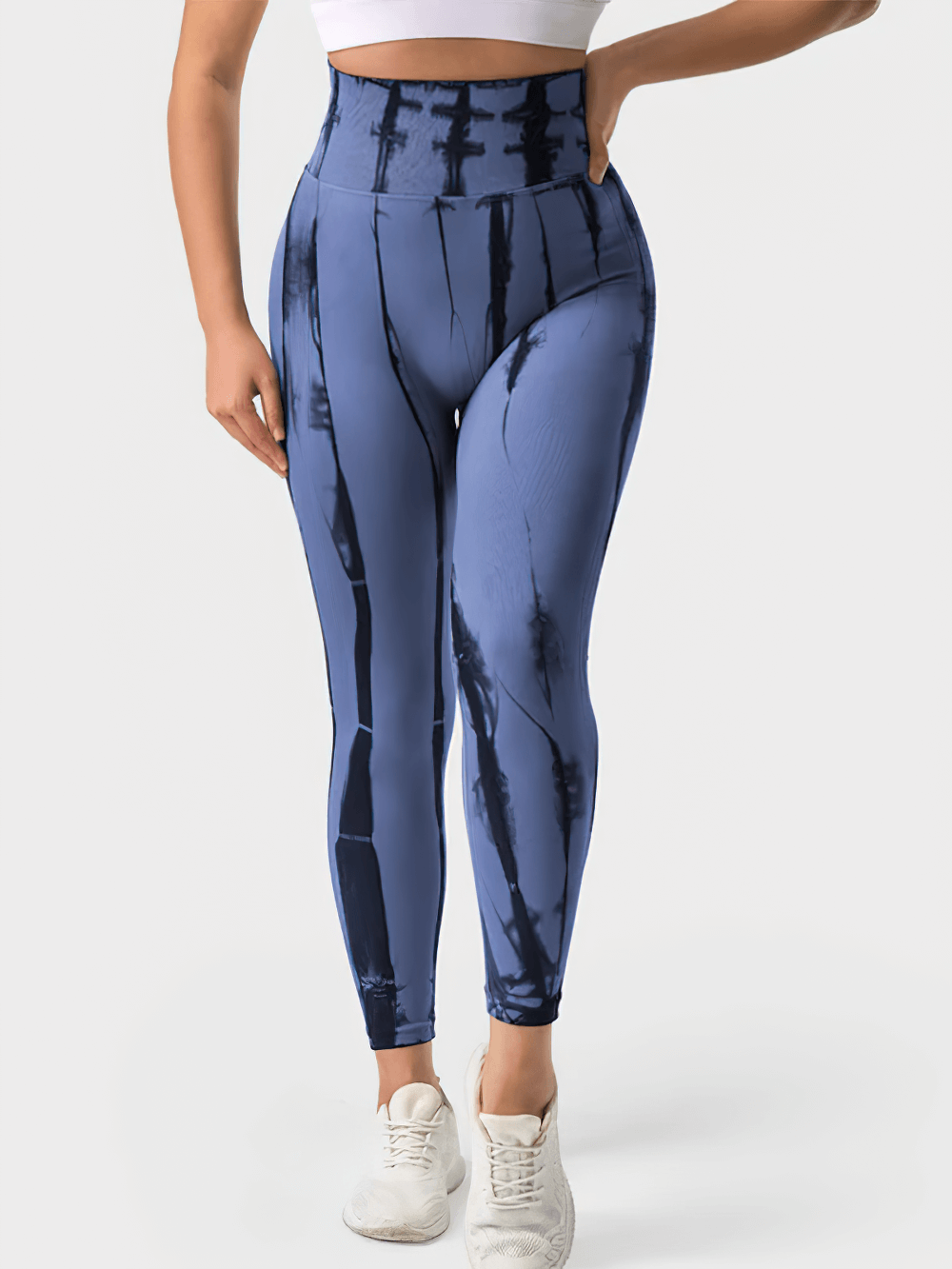 Woman wearing Push Up Seamless Tie Dye Pants for Gym and Sports - SF4029 in blue and black with high waist and seamless fit.