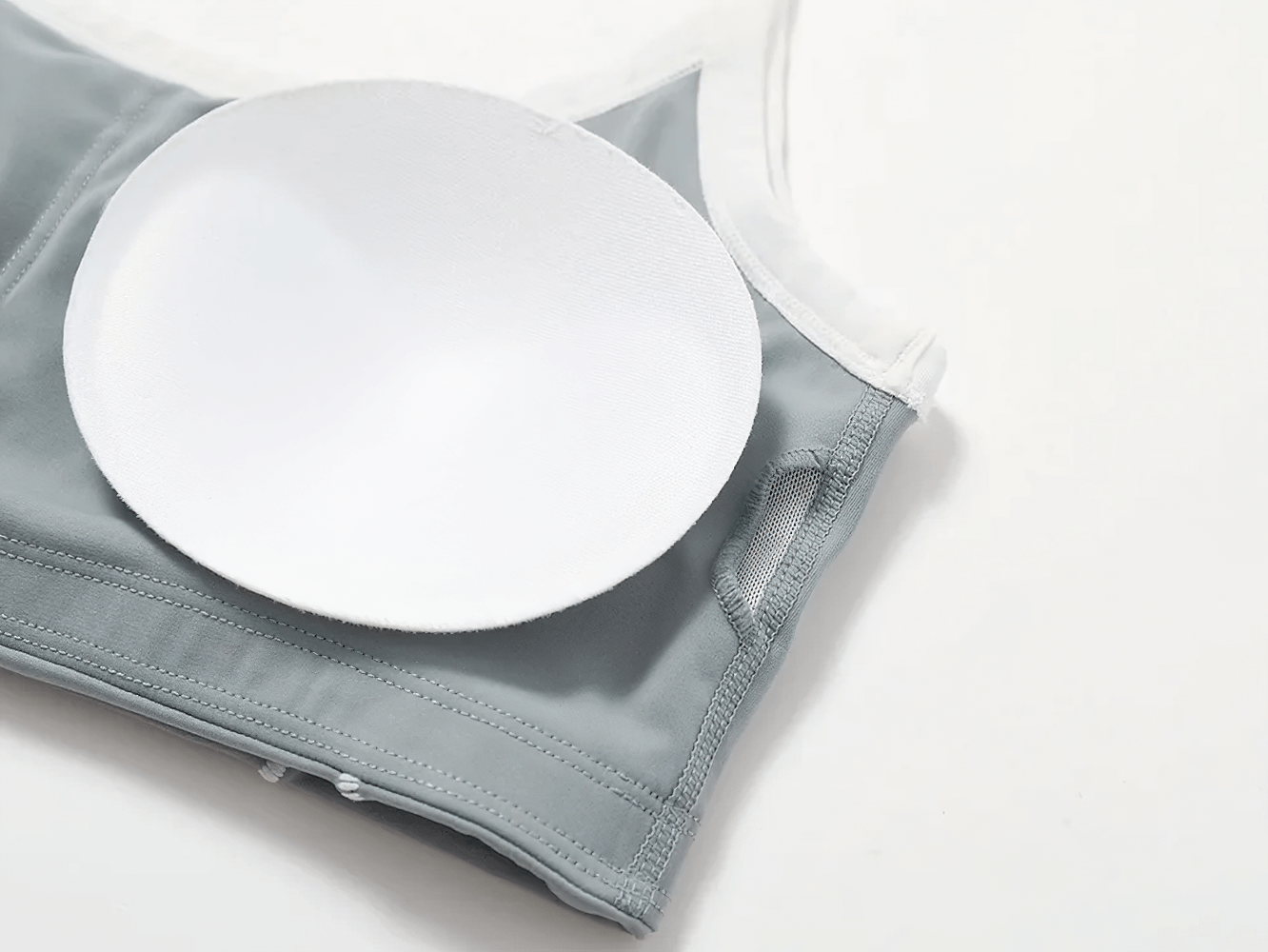 Gray push-up sports bra with removable pad, ideal for yoga, fitness, and outdoor activities. Stylish, breathable, and supportive design.