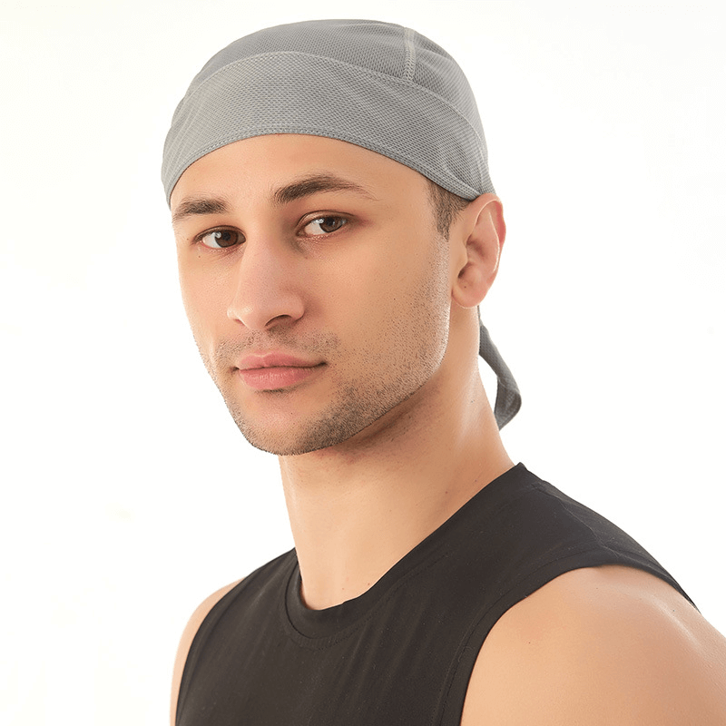 Man wearing Quick Dry Cycling Cap with UV protection, lightweight polyester, and modern design.